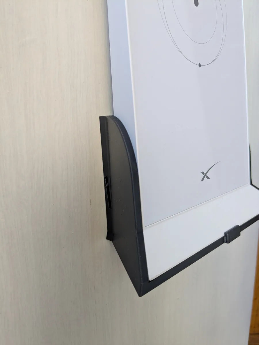 Close side view of the black StarMax bracket cradling the base of the Starlink Gen 2 router.