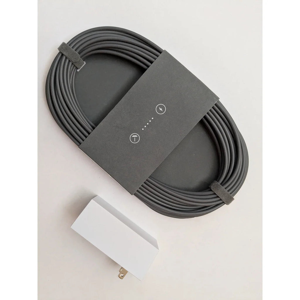 The Starlink power supply and coiled DC cable that connect the Gen 3 router to mains power.