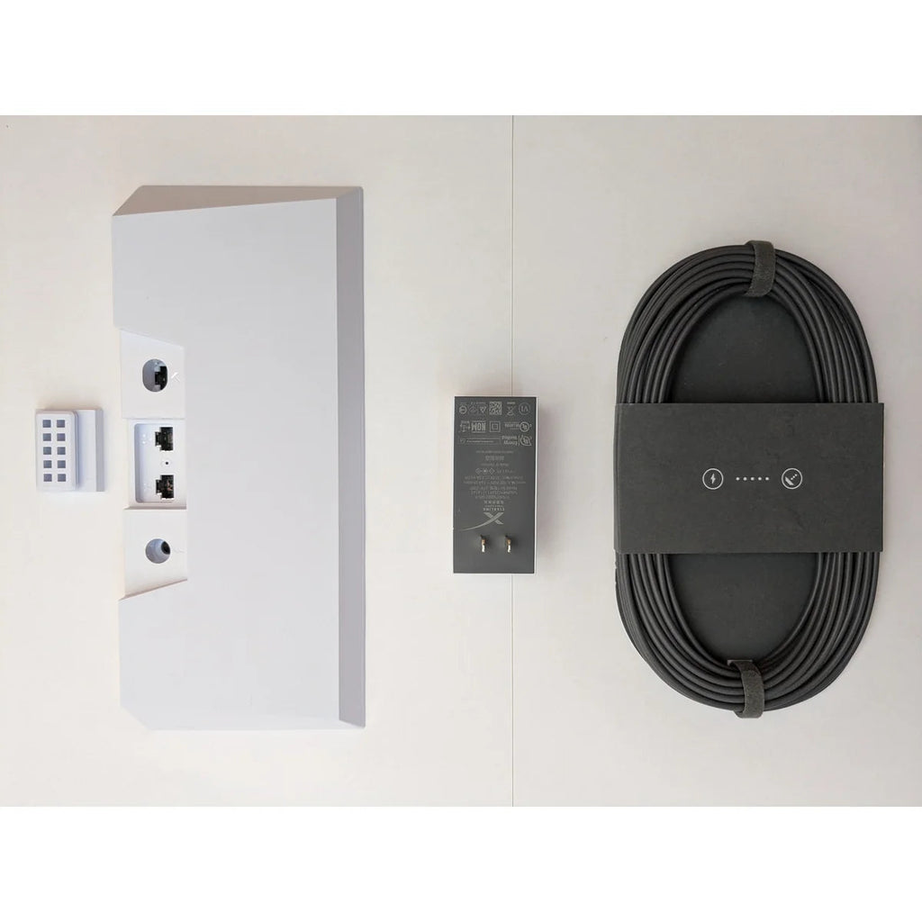 Everything in the kit laid out: Starlink Gen 3 router, power supply, DC cable and cable clip.