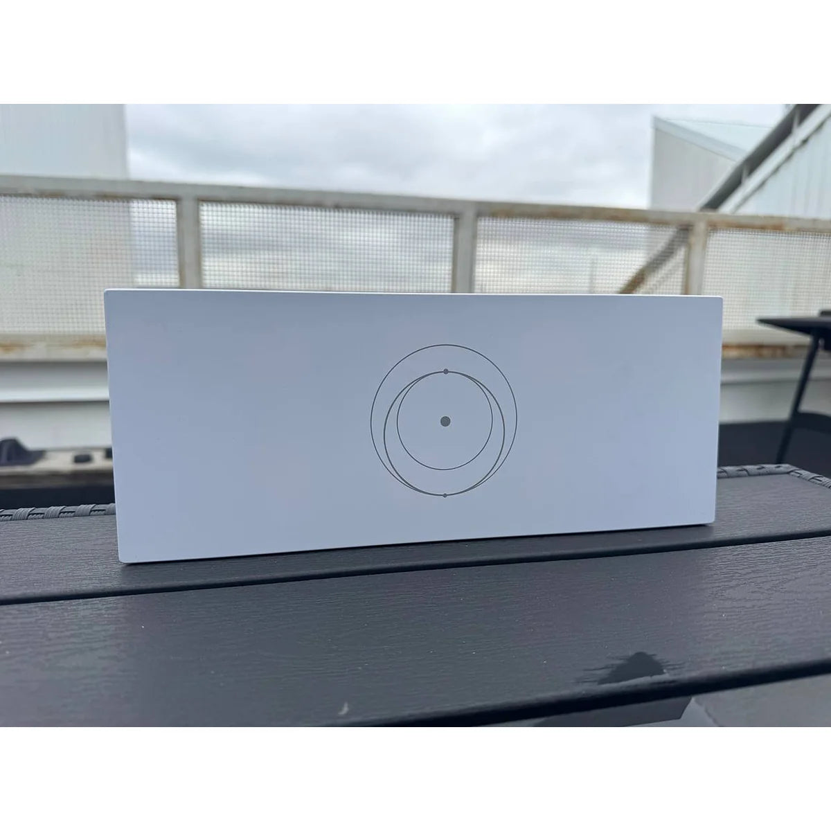 Genuine Starlink Gen 3 router photographed in daylight, showing the clean white housing.