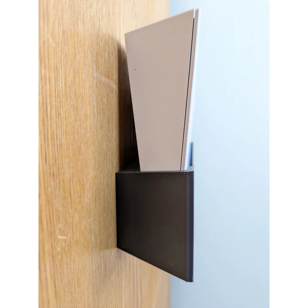 Close side view of the Starlink Gen 3 router held in the black StarMax wall bracket.