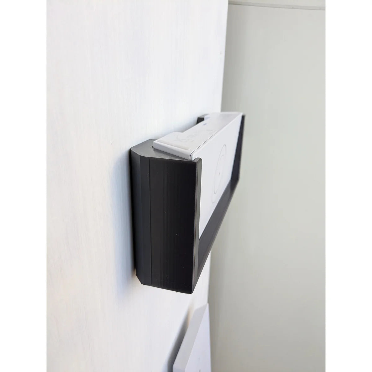 Edge profile of the installed Starlink Gen 3 router mount seen from the side of the wall.