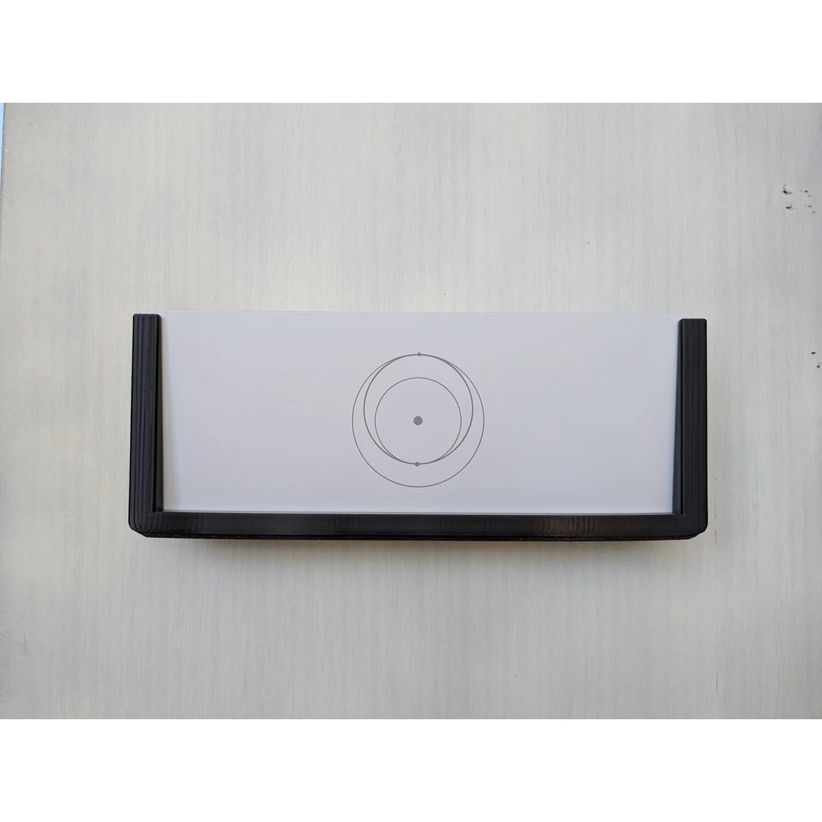Starlink Gen 3 router seated in the black StarMax wall mount bracket, viewed straight on.