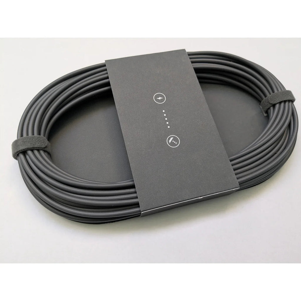 Coiled Starlink Mini DC power cable seen at an angle, showing the printed sleeve and cable thickness.