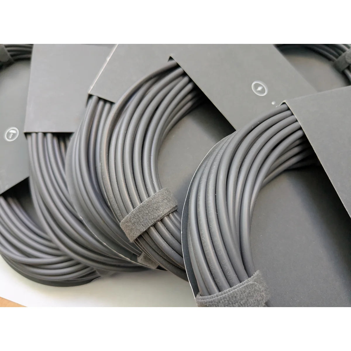 Close-up of the Starlink Mini DC power cable jacket showing the printed UL file number and ratings.