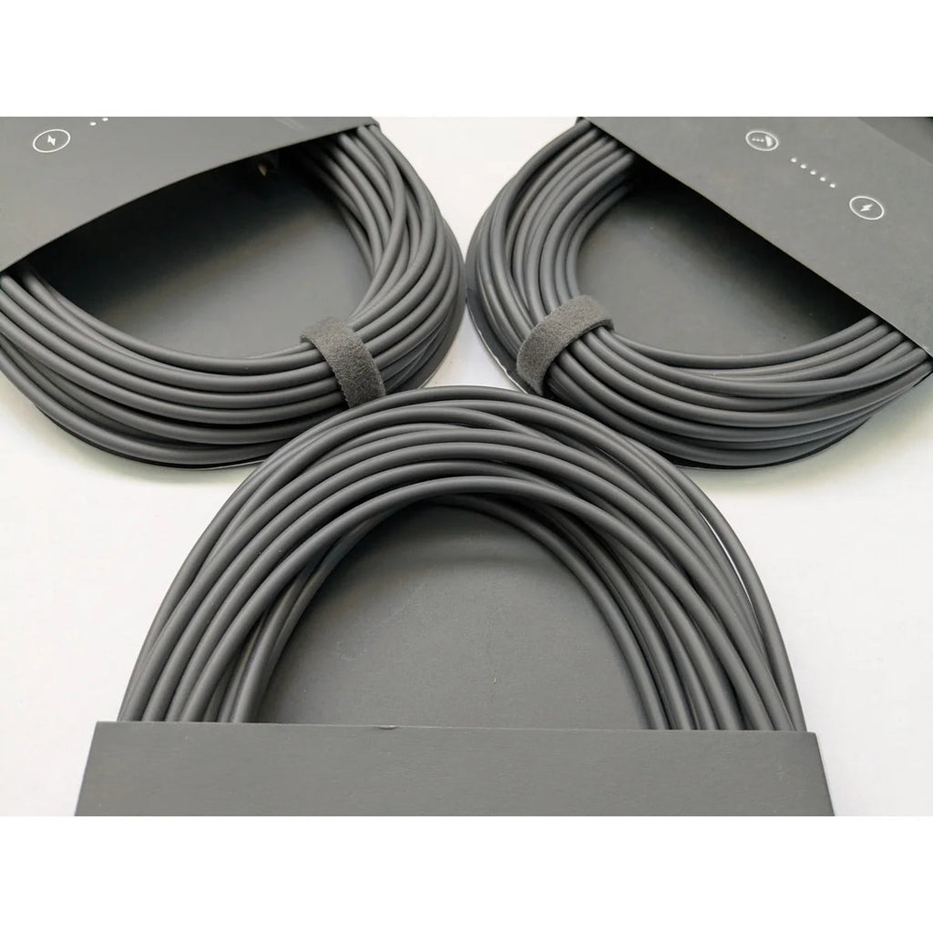 Three coiled Starlink Mini DC power cables arranged together, showing consistent factory coiling.