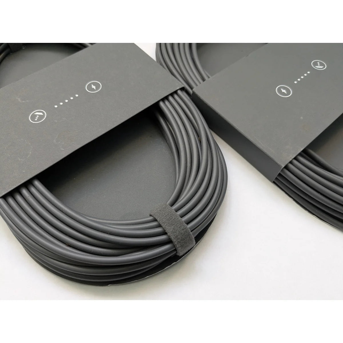 Two genuine Starlink Mini DC power cables side by side, each in its original printed sleeve.