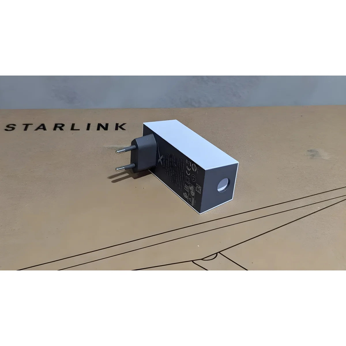 Genuine Starlink Mini power supply with EU plug, showing the round DC output port on the end.
