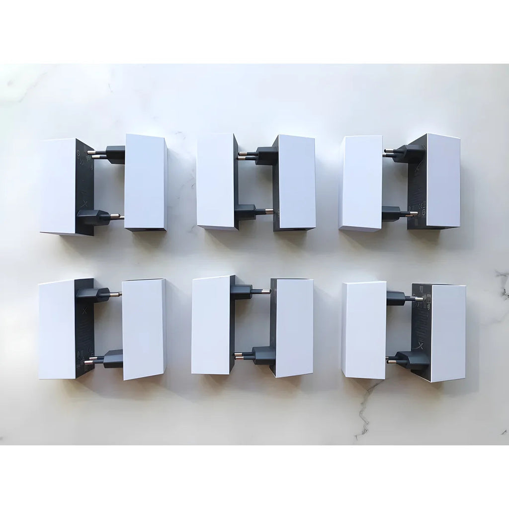 Six genuine Starlink Mini power supplies with EU Type C plugs, arranged top-down on white.