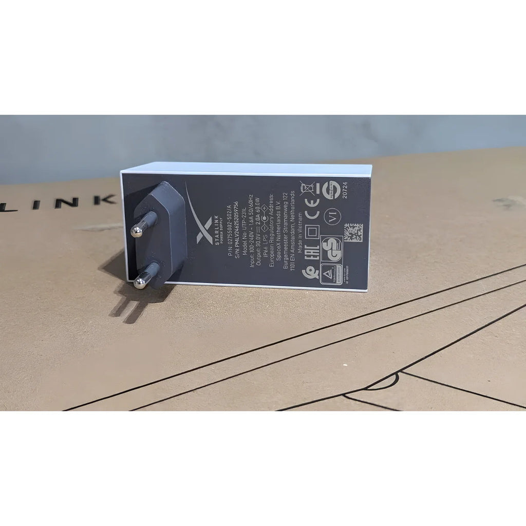 Close-up of the Starlink Mini power supply label: 100-240 V input, 30 V 2 A 60 W output, IP66 LPS.