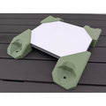StarMax four-piece corner mount kit in green fitted to a Starlink Mini, seen from above at an angle.
