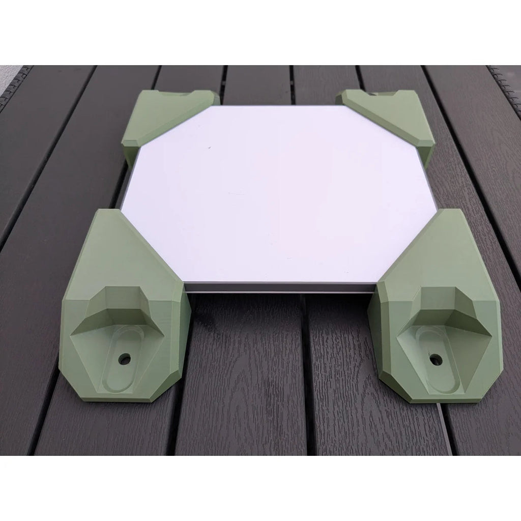 Top view of the Starlink Mini held by all four StarMax corner brackets, showing the low profile.