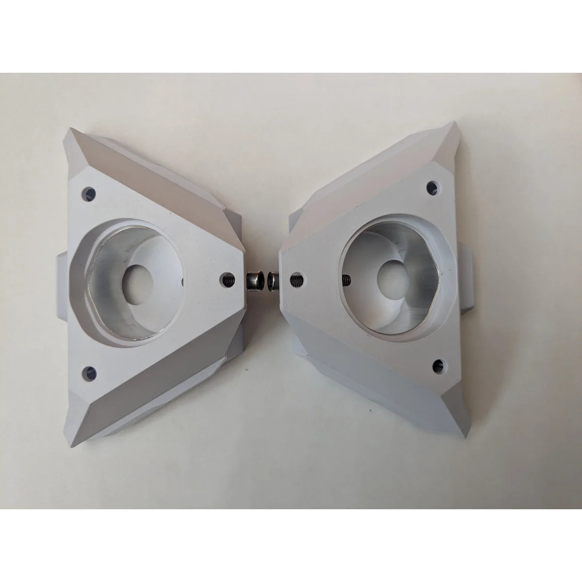 Two genuine Starlink pipe adapters placed face to face, showing the bore and threaded inserts.