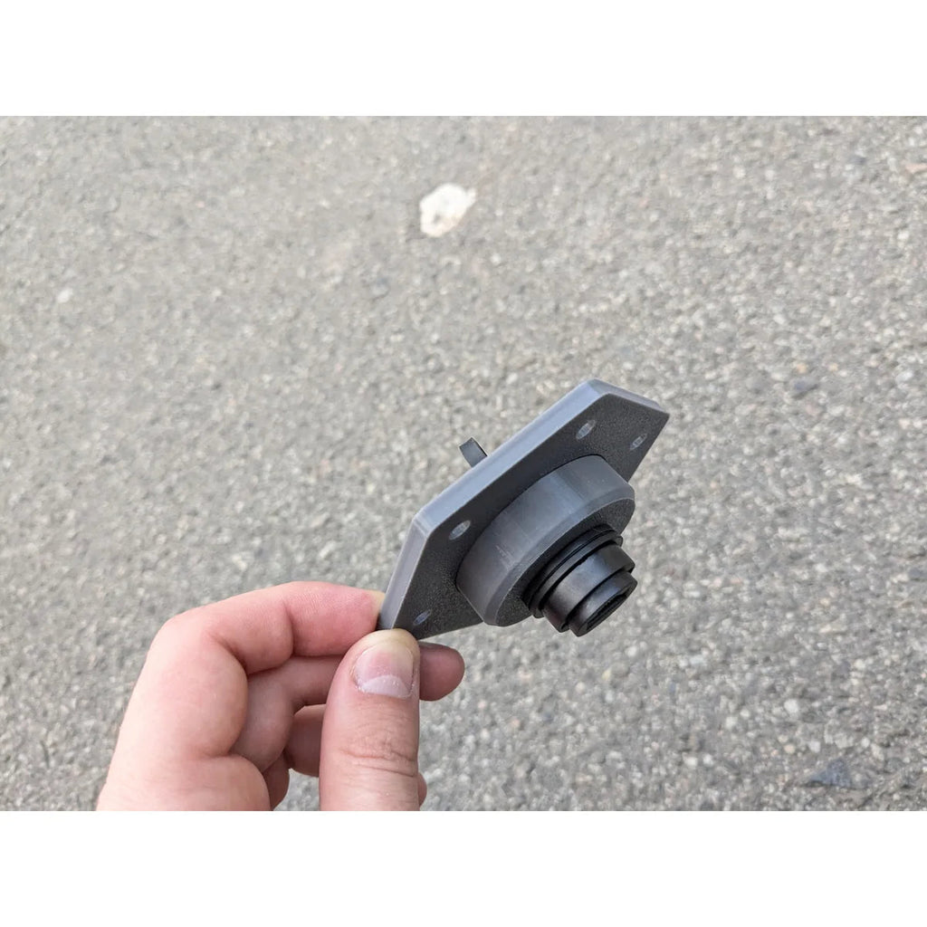 StarMax panel socket held in a hand, showing its size and the threaded barrel behind the plate.