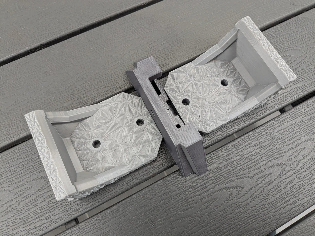 Two StarMax brackets joined by the sliding centre piece, showing the adjustable spacing between mount feet.