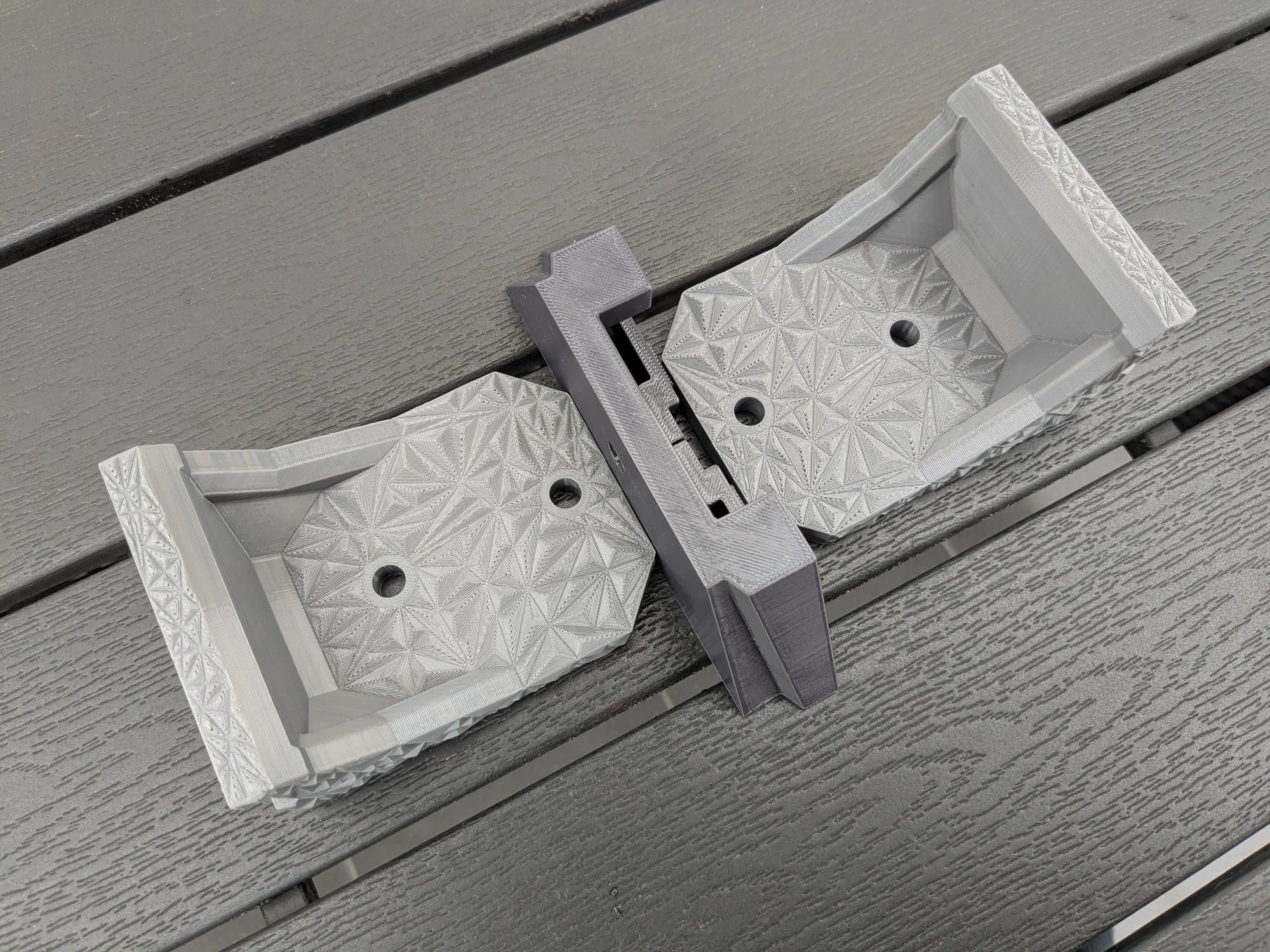 Two StarMax brackets joined by the sliding centre piece, showing the adjustable spacing between mount feet.