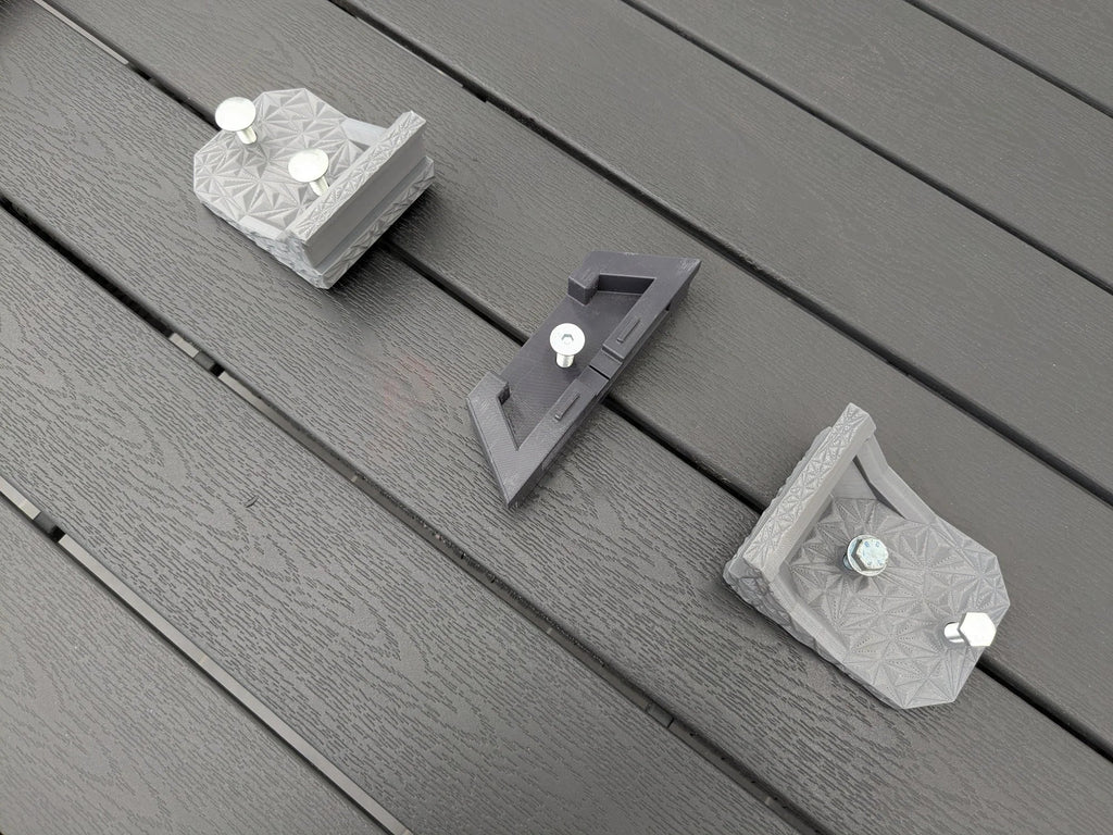 StarMax Starlink Mini mount brackets laid out with zinc-plated bolts inserted through the fixing holes.