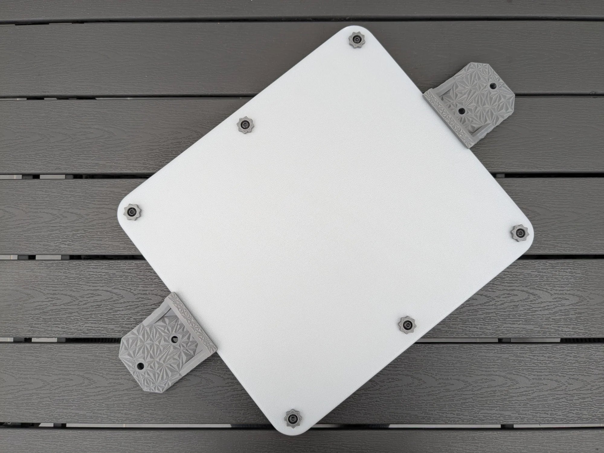 Starlink Mini roof mount kit by StarMax: armor case seen from above with two grey brackets fitted.